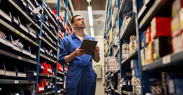 Worker Looking at Parts